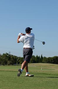 Man golfing enjoying his free time while he has his money working for him.