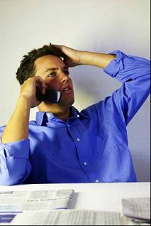 man talking on the phone to his stockbroker
